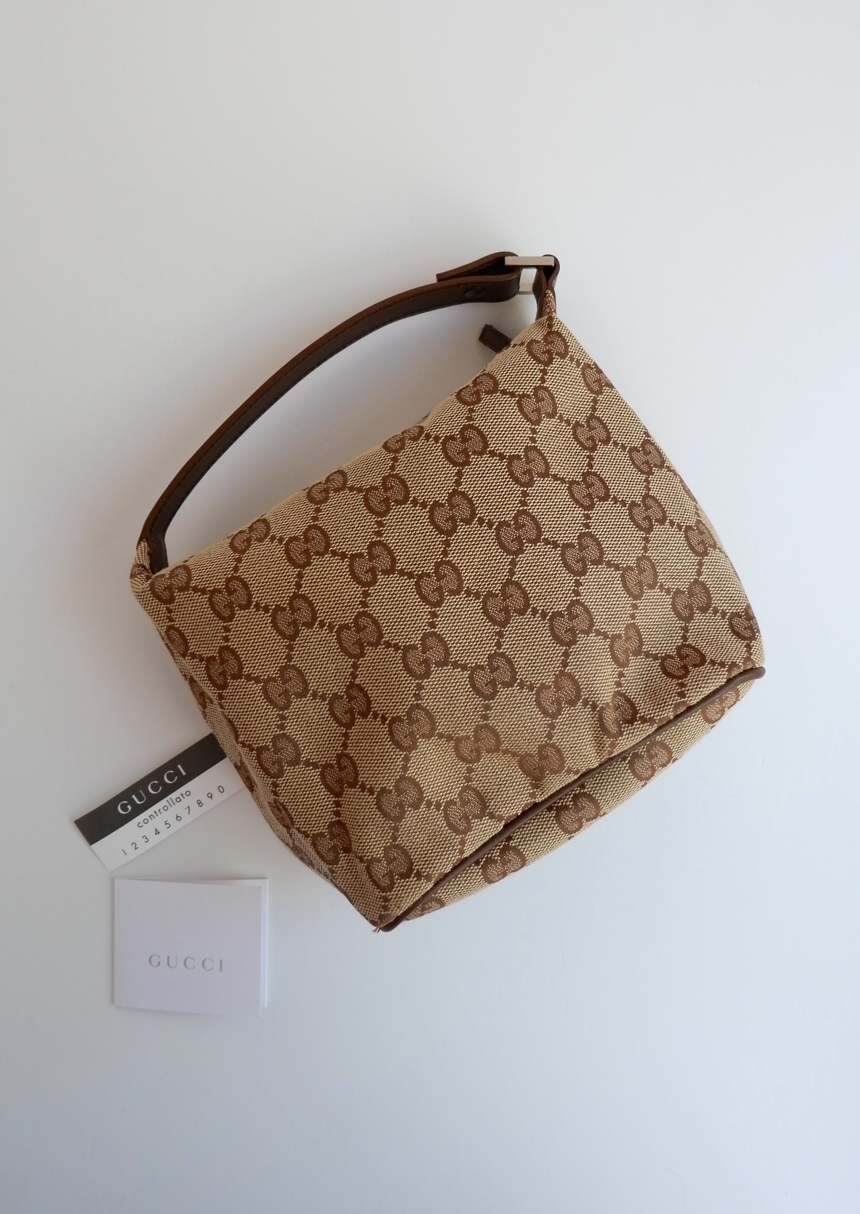 Authentique Sac Pochette Gucci en Toile GG Marron d'occasion