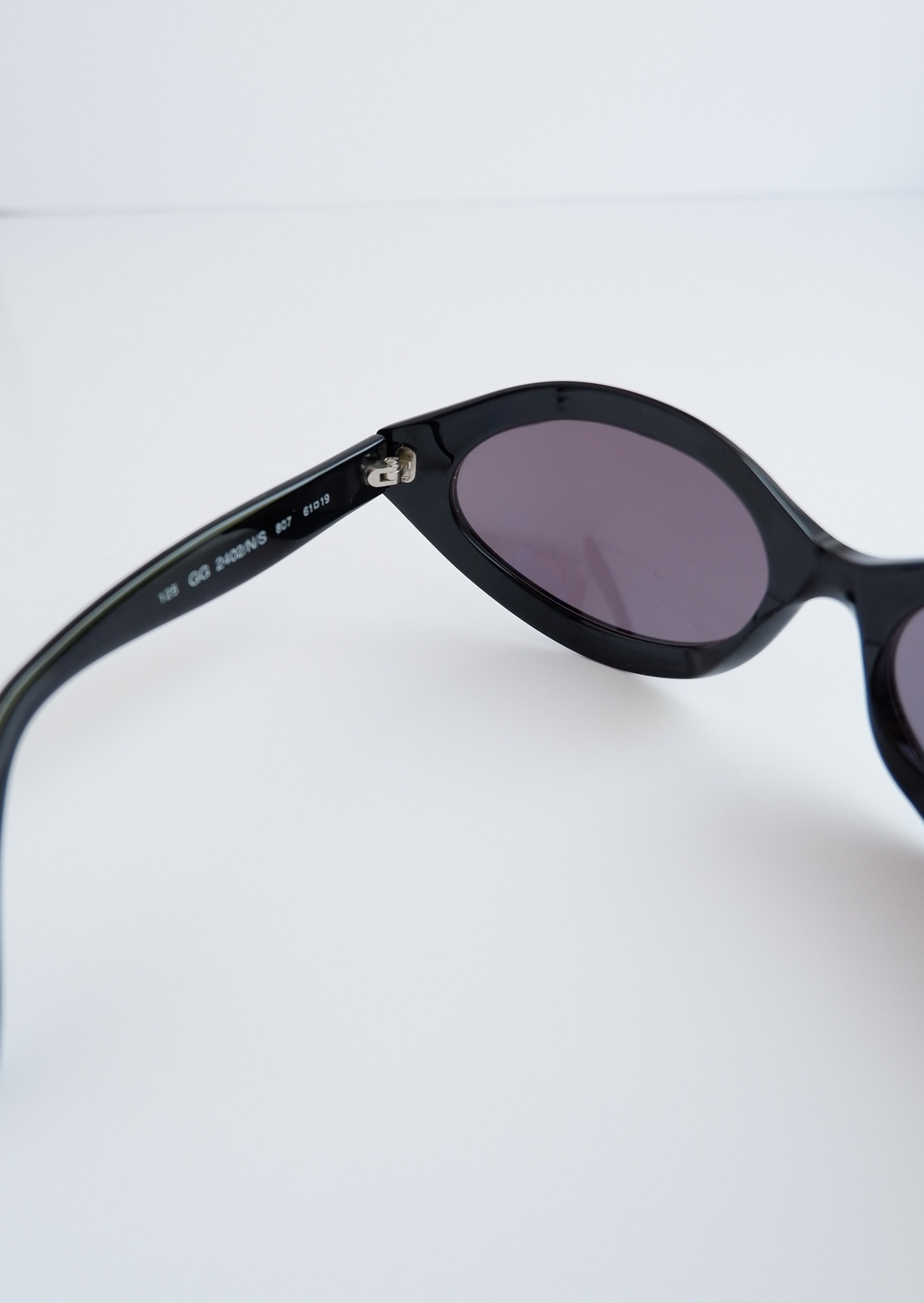 Véritables lunettes de soleil vintage Gucci d'occasion à monture ronde noire