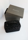 Authentique sac vanity Gucci en daim noir imprimé GG, d'occasion
