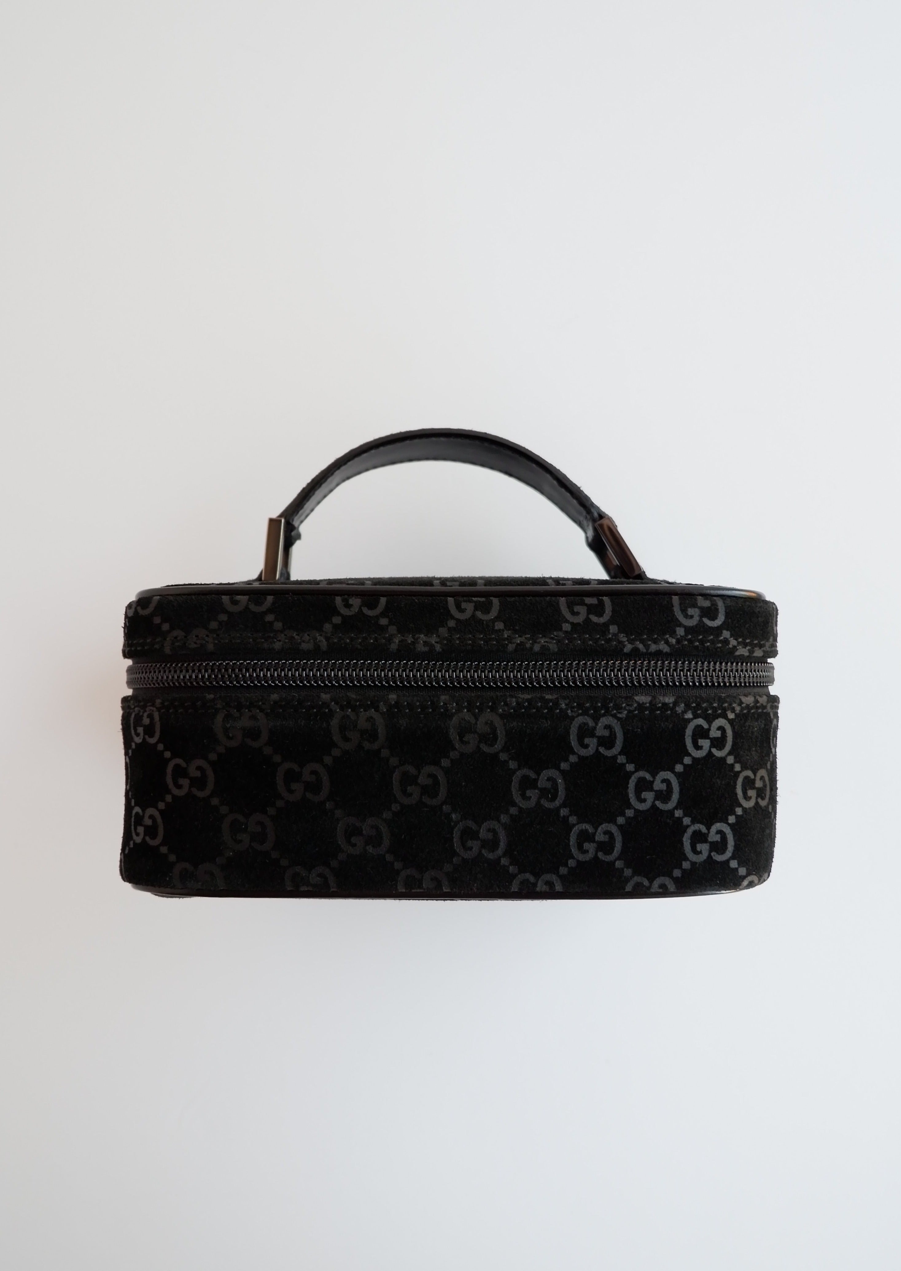 Authentique sac vanity Gucci en daim noir imprimé GG, d'occasion