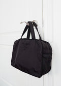 Authentique sac à main Prada en nylon noir orné du logo perlé, d'occasion