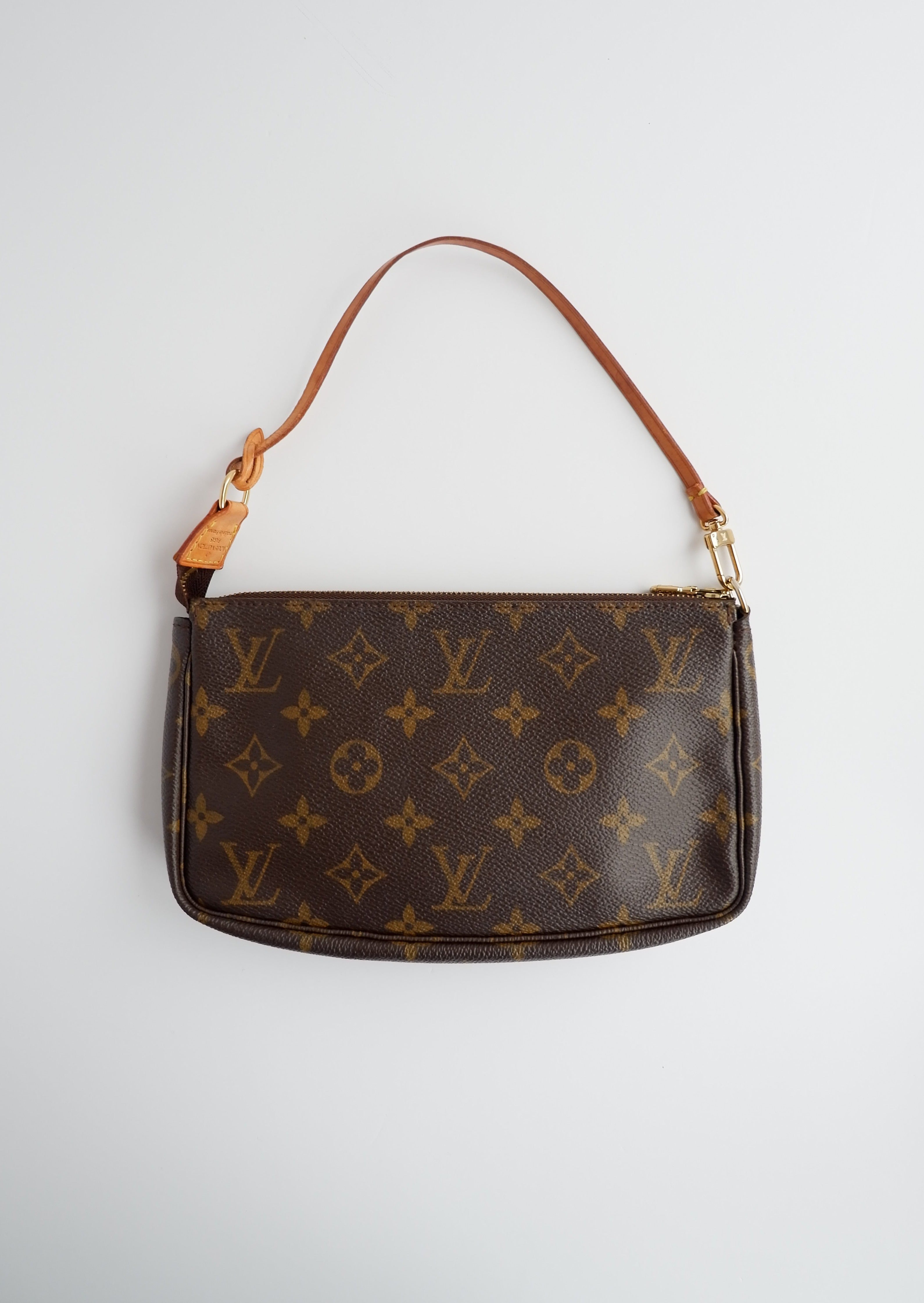 Sac à accessoires Pochette Monogram Louis Vuitton d'occasion authentique