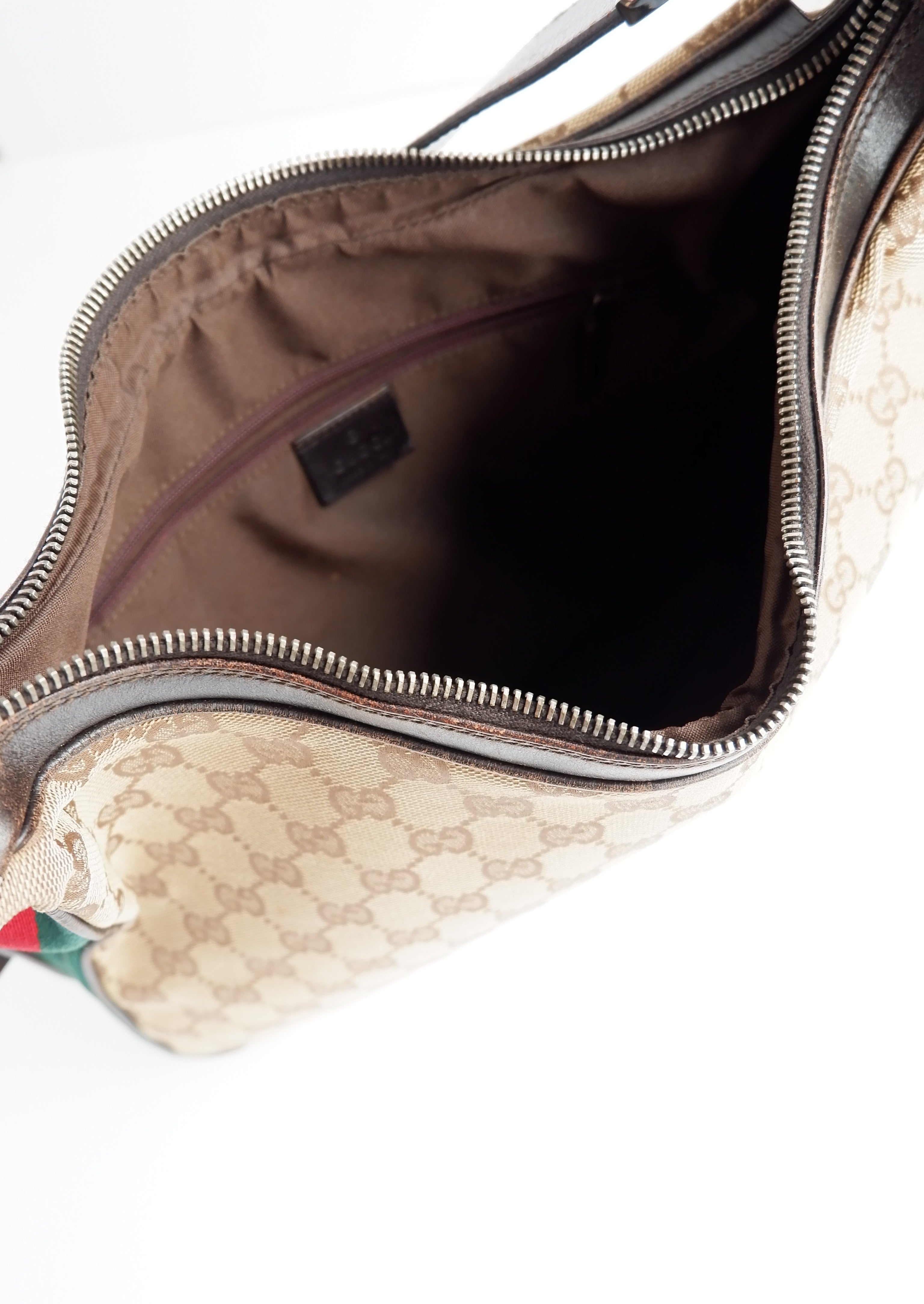 Authentique sac bandoulière Gucci d'occasion avec imprimé GG et bande Web