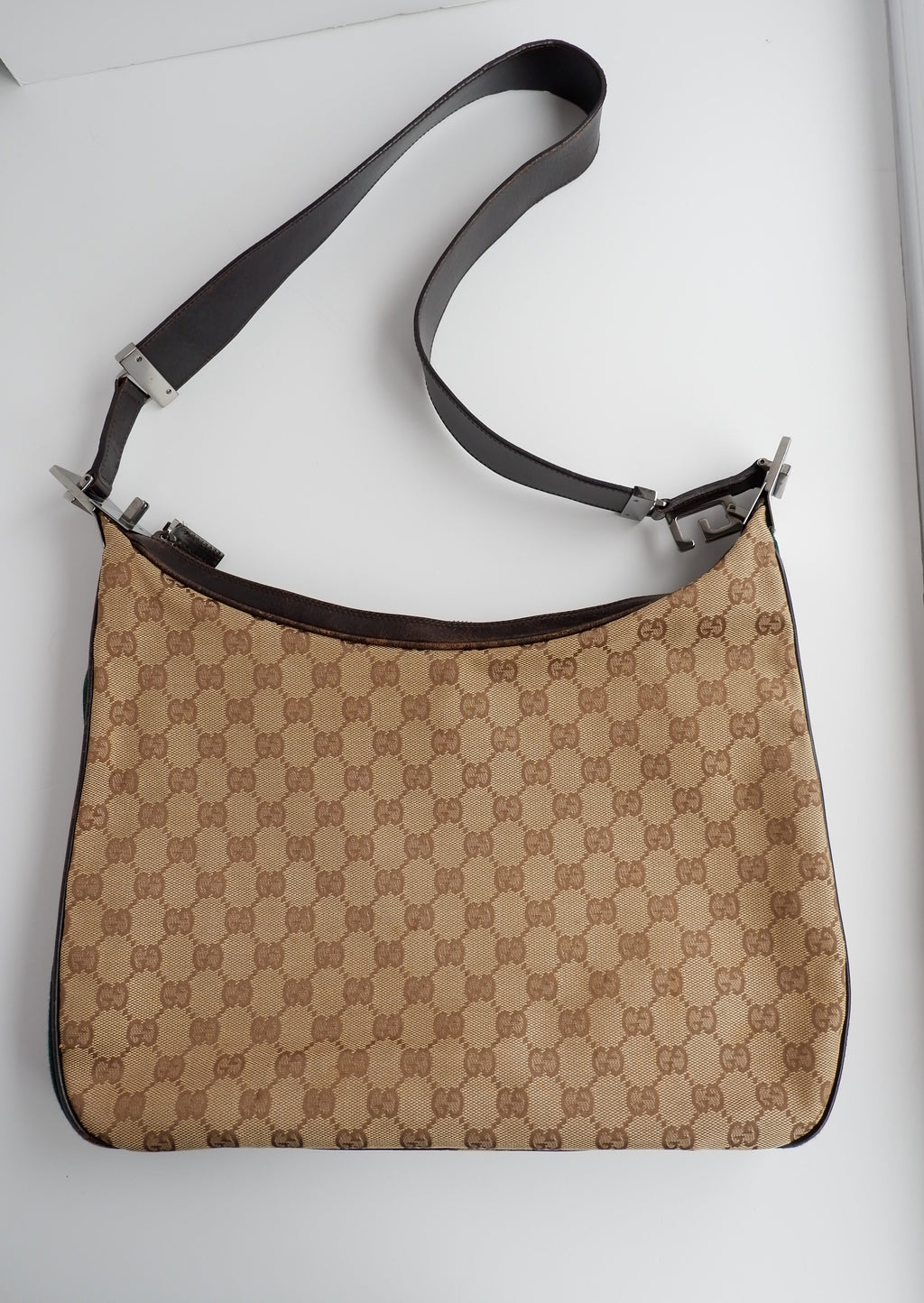 Authentique sac bandoulière Gucci d'occasion avec imprimé GG et bande Web