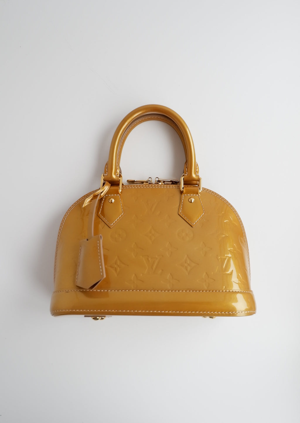 Authentique sac Louis Vuitton Monogram Gold Vernis Alma BB d'occasion