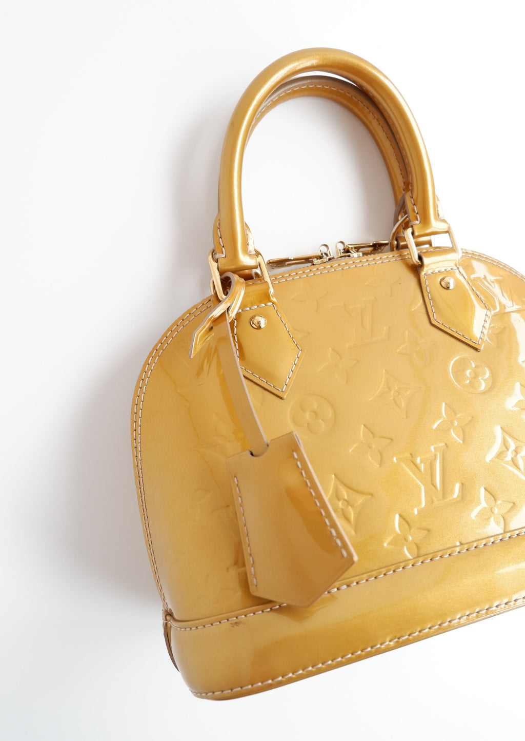 Authentique sac Louis Vuitton Monogram Gold Vernis Alma BB d'occasion