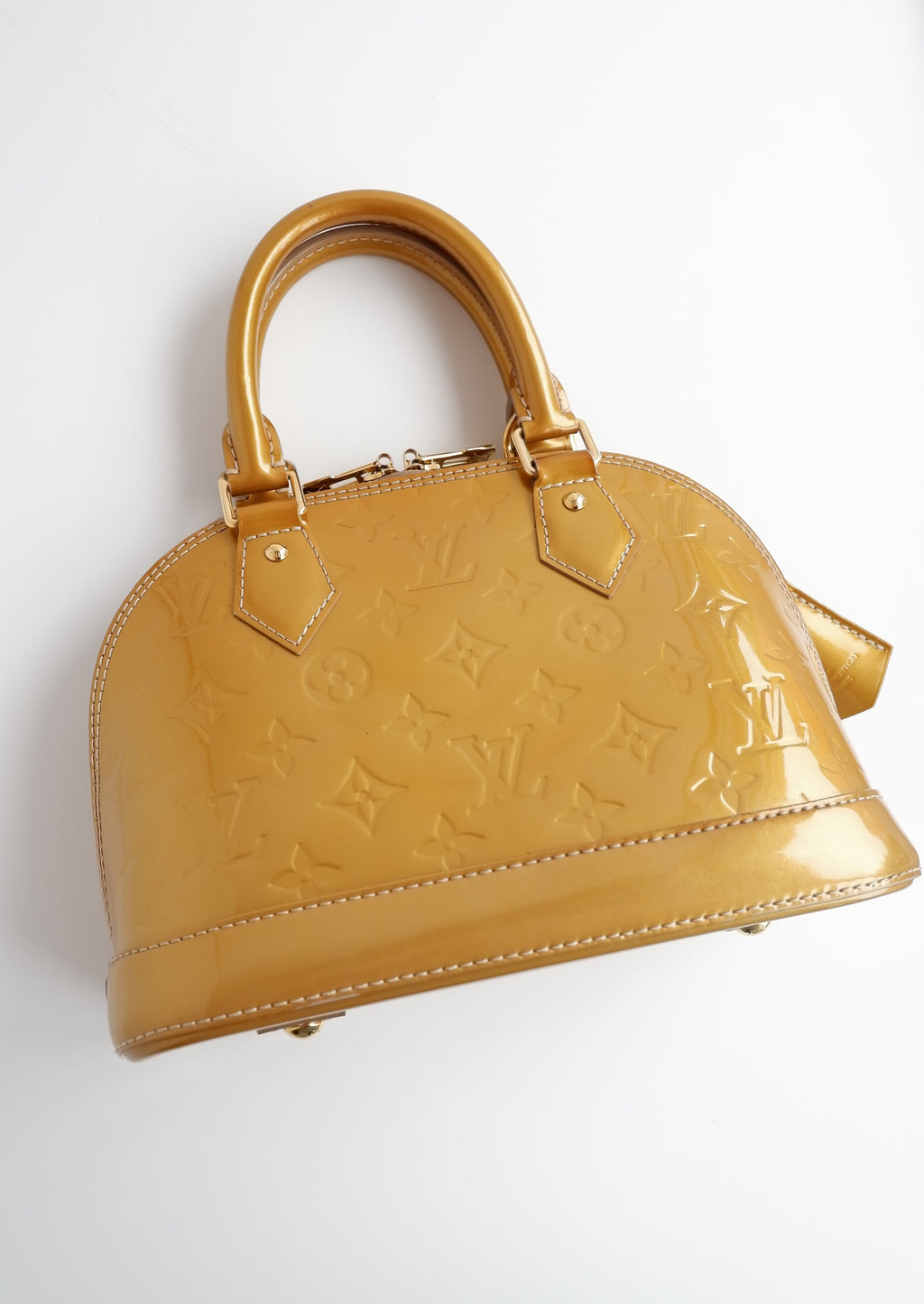 Authentique sac Louis Vuitton Monogram Gold Vernis Alma BB d'occasion