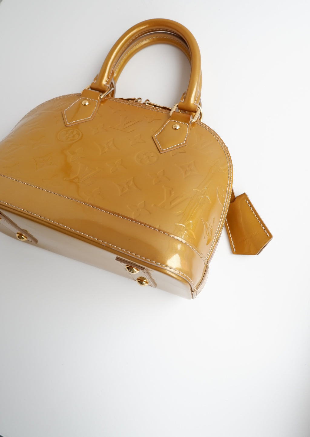 Authentique sac Louis Vuitton Monogram Gold Vernis Alma BB d'occasion