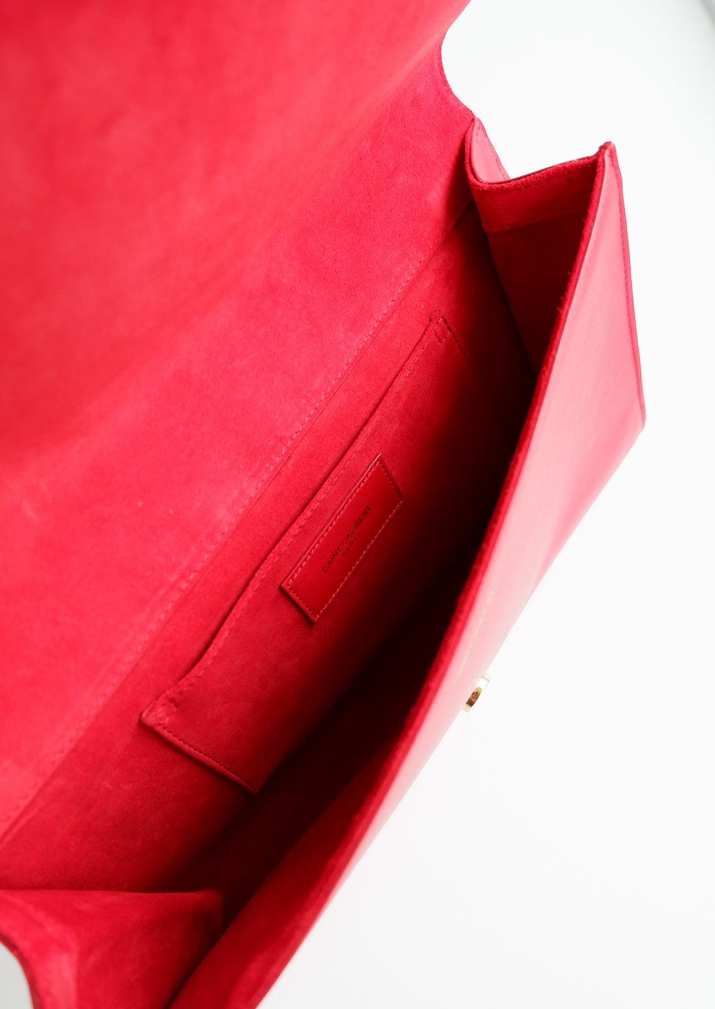 Pochette Saint Laurent authentique d'occasion en cuir rouge