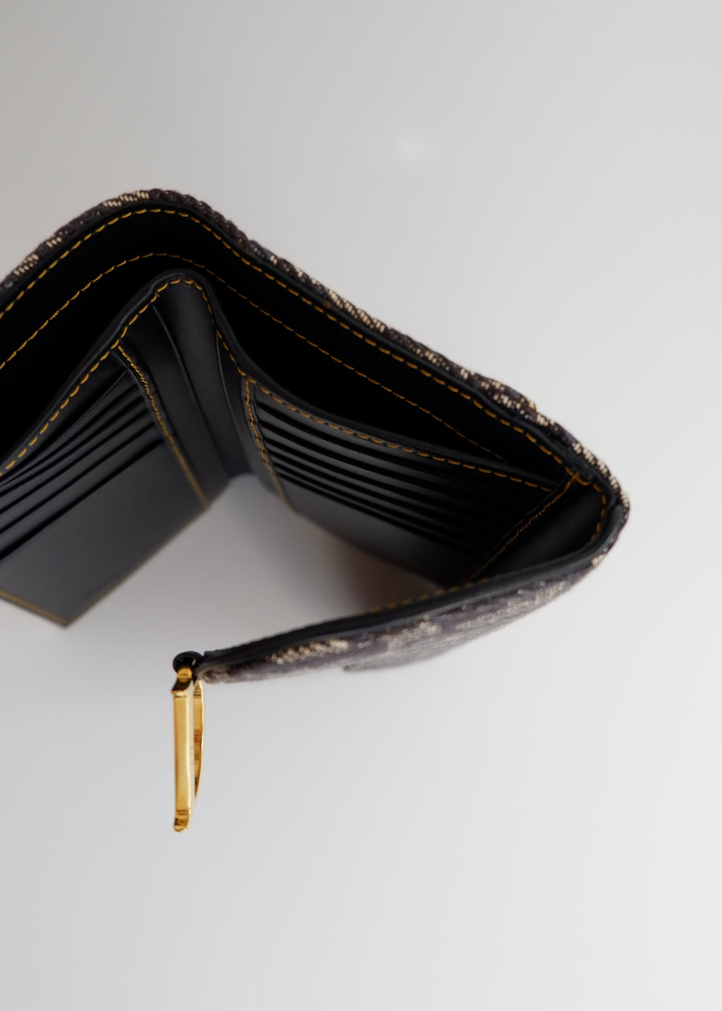 Portefeuille Dior authentique d'occasion en toile trotteur bleu marine