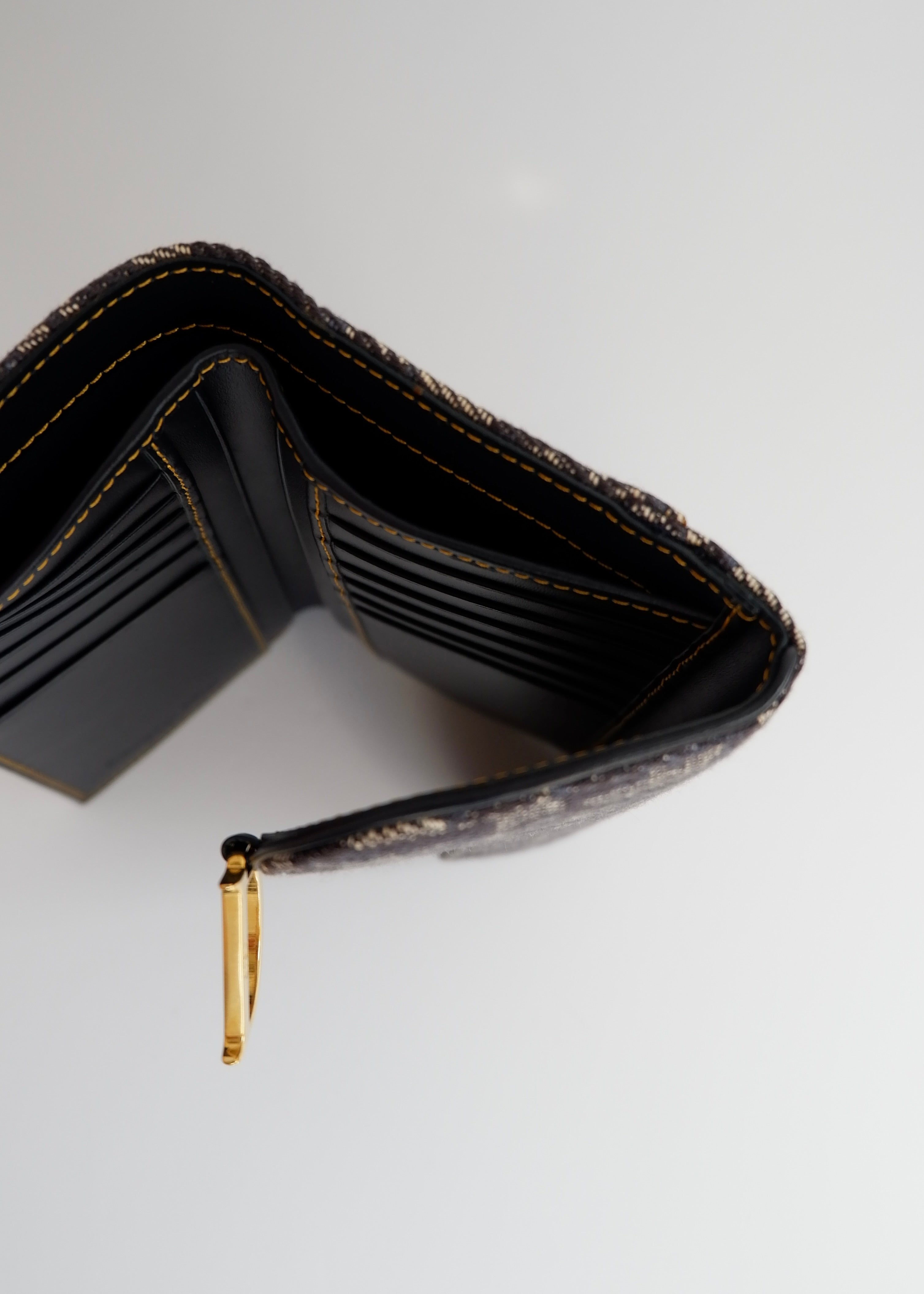 Portefeuille Dior authentique d'occasion en toile trotteur bleu marine