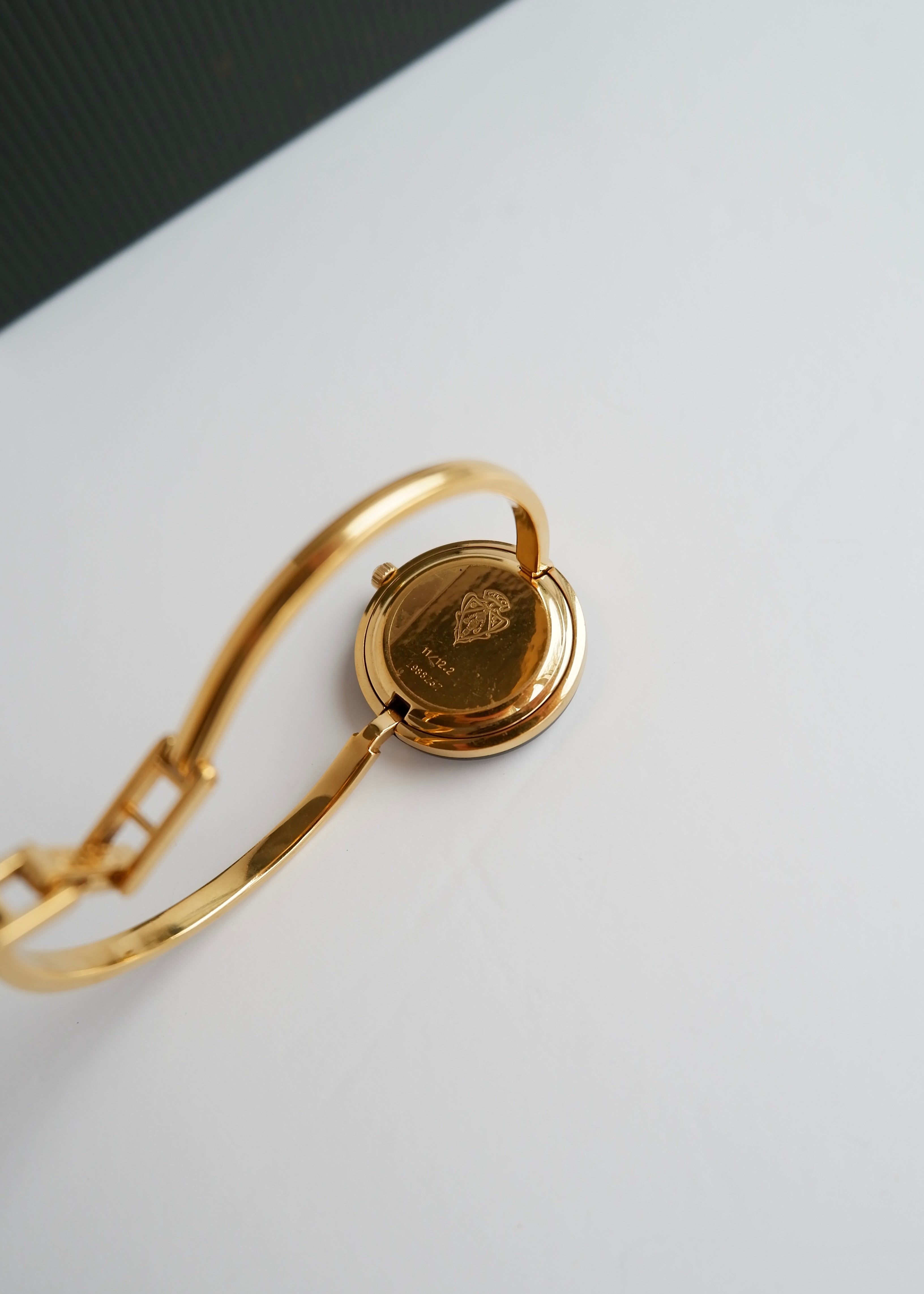 Montre Gucci authentique d'occasion à lunette interchangeable multicolore