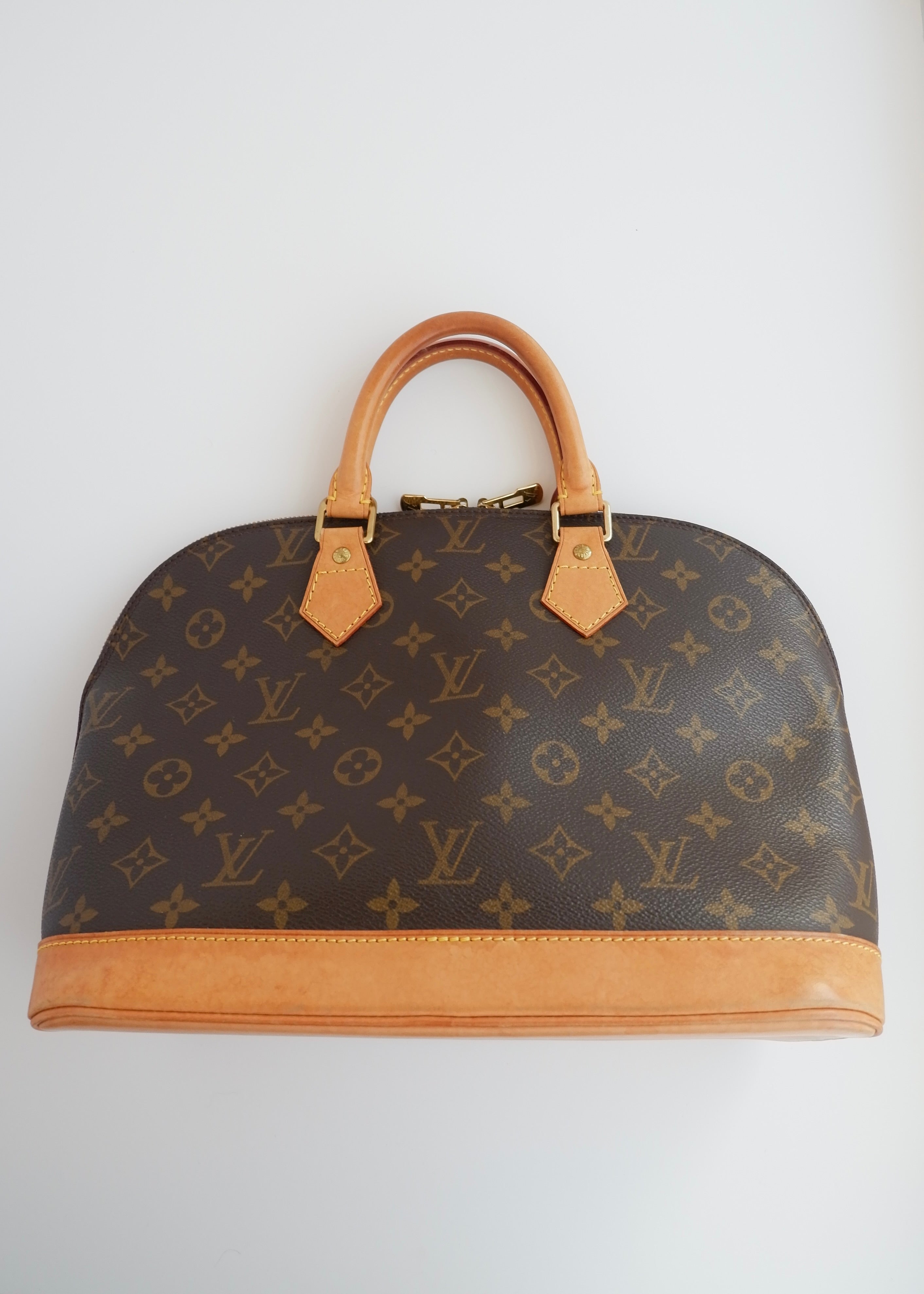 Sac à main Louis Vuitton Alma Monogram d'occasion authentique